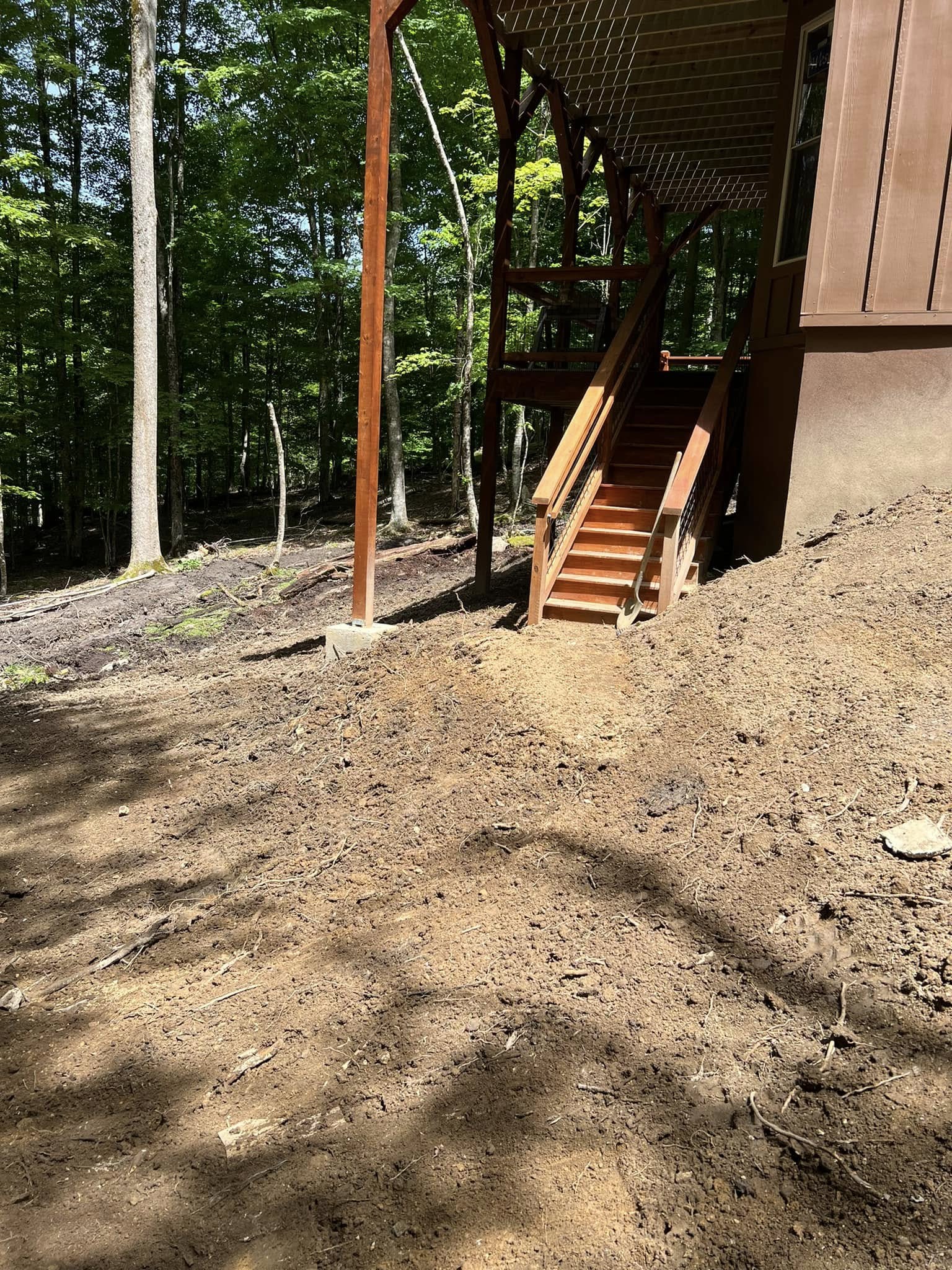 Final-graded slope and access to the deck stairs