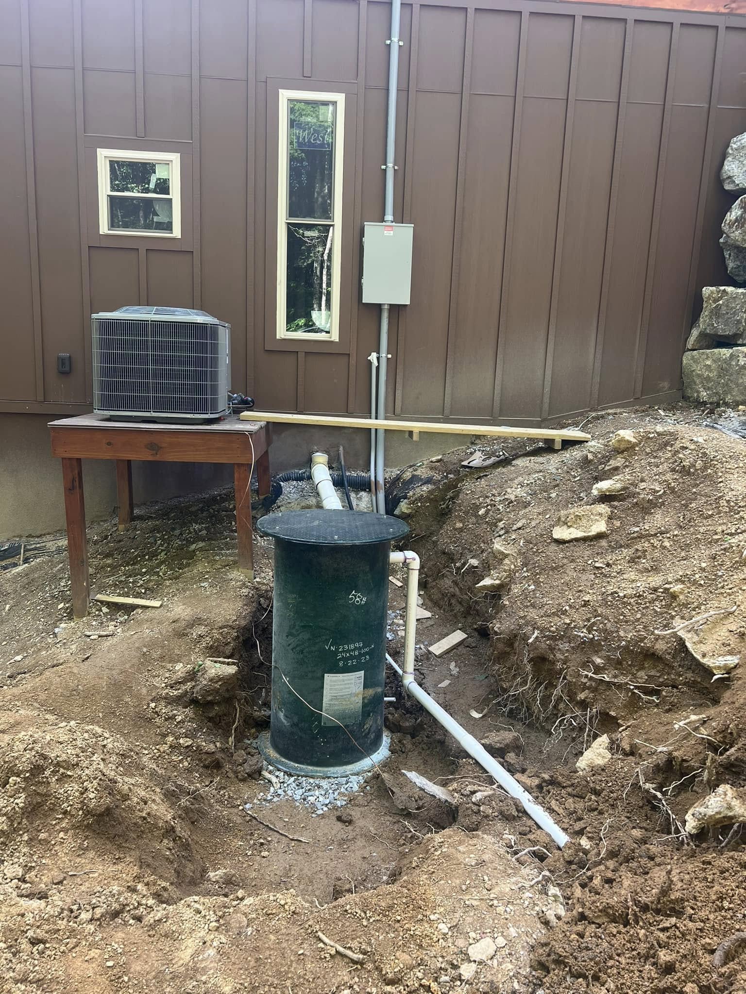 Septic pump riser with water line and power connections run to the house